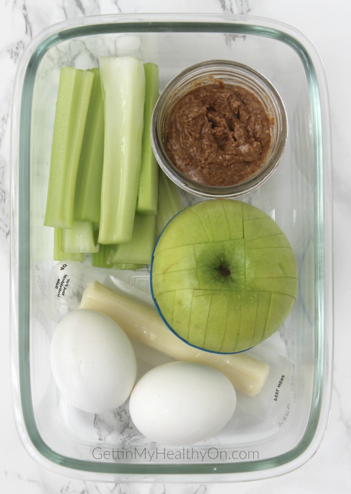 Snack Box with Eggs, Apple, Celery, and Almond Butter