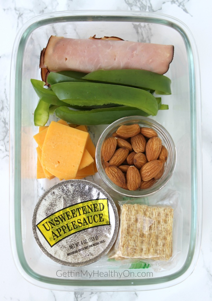 Snack Box with Ham, Cheddar, Crackers, Almonds, Green Pepperss, and Applesauce