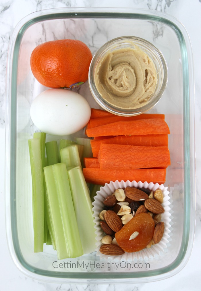 Snack Box with Hummus, Carrots, Celery, Egg, Clementine, and Trail Mix