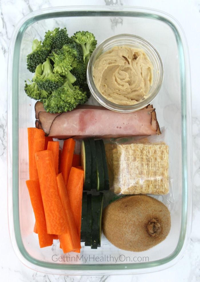 Snack Box with Hummus, Crackers, Broccoli, Carrots, Ham, and Kiwi